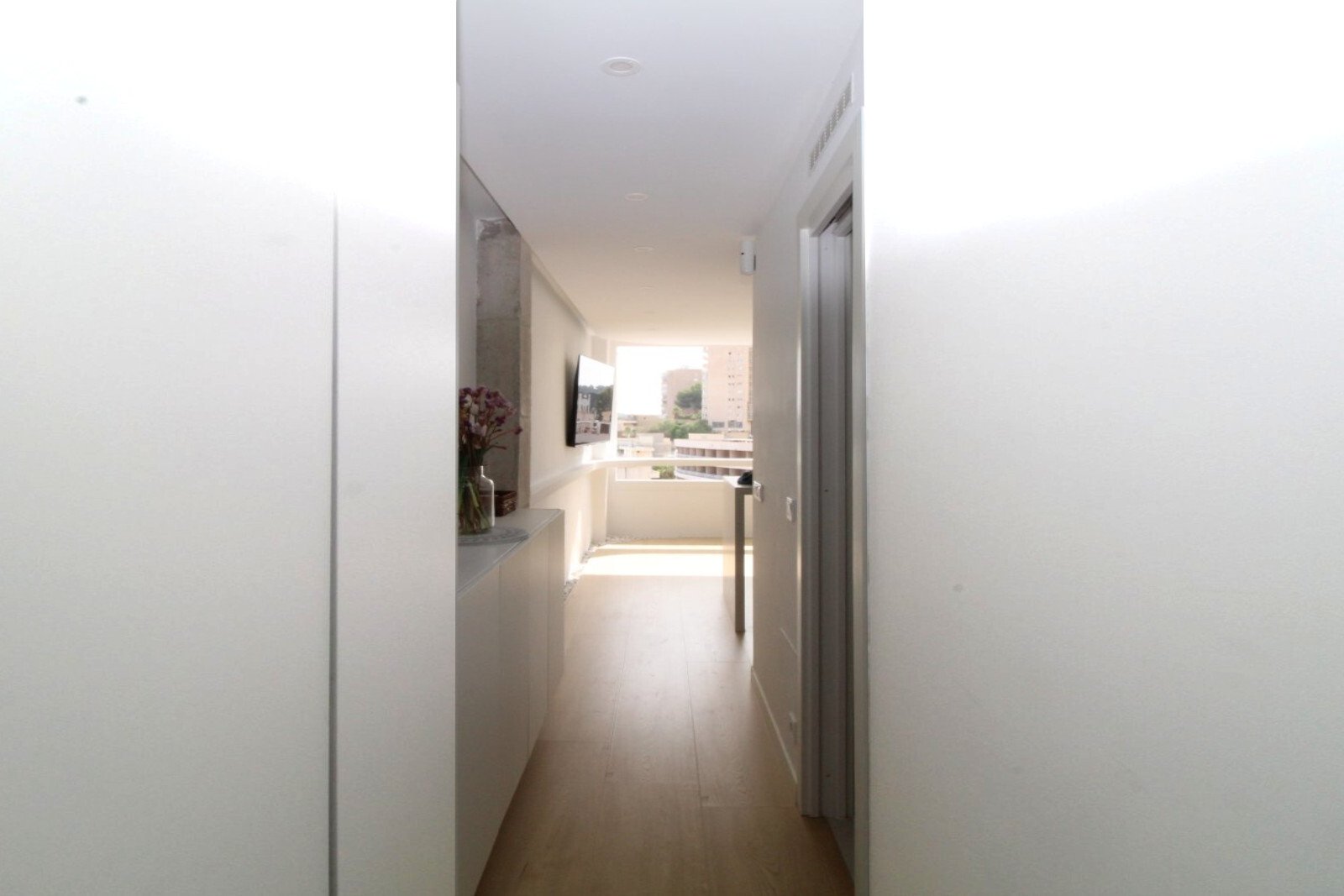 Bright corridor area with a practical niche shelf and optimized flow of space Bright corridor area with a practical niche shelf and optimized flow of space