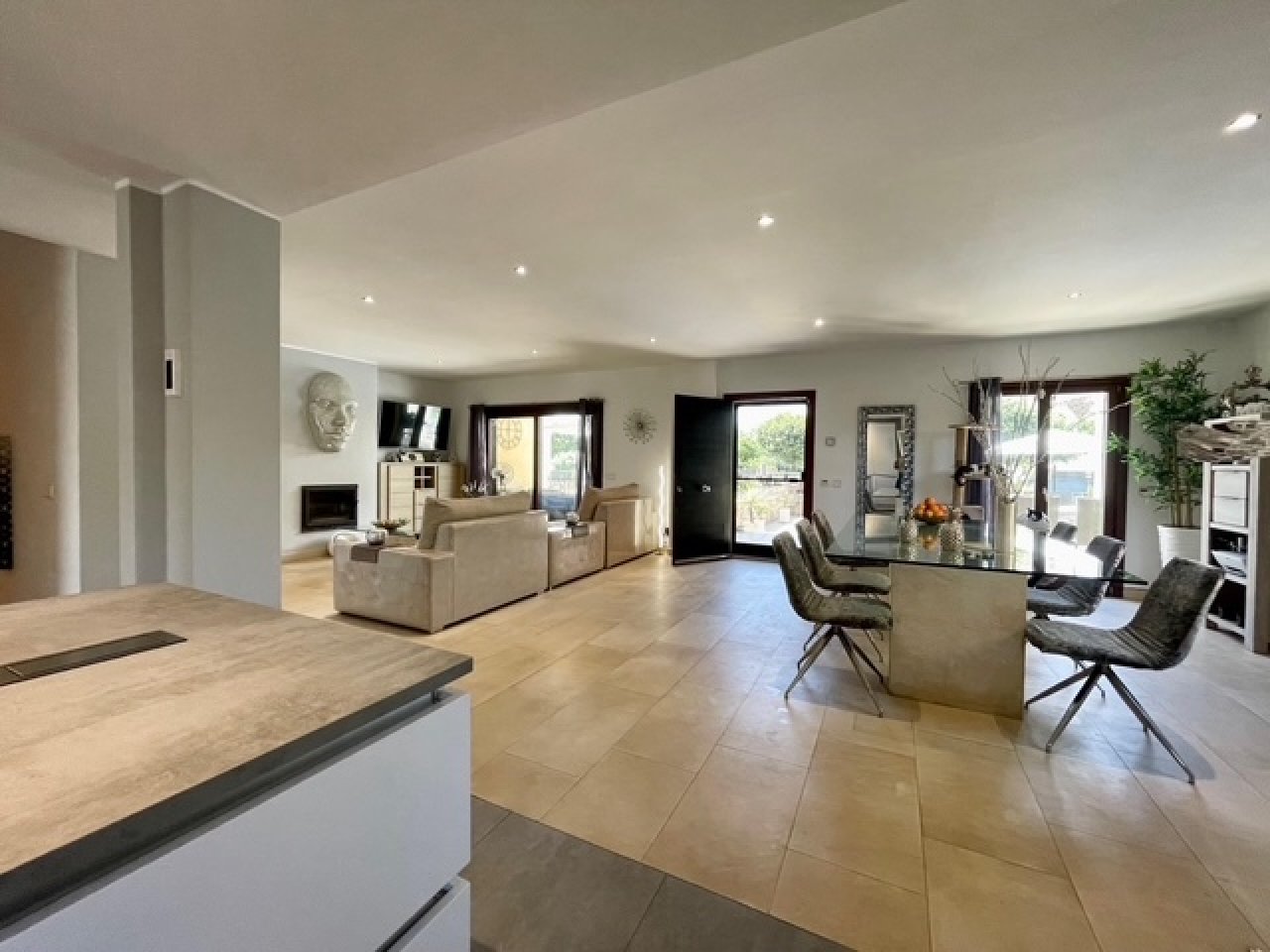 Open living concept with seamless transitions between kitchen, living, and dining areas Open living concept with seamless transitions between kitchen, living, and dining areas