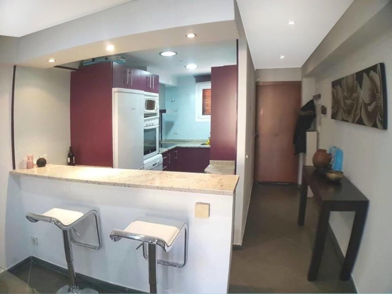 Open kitchen with kitchen bar and flowing living areas Open kitchen with kitchen bar and flowing living areas