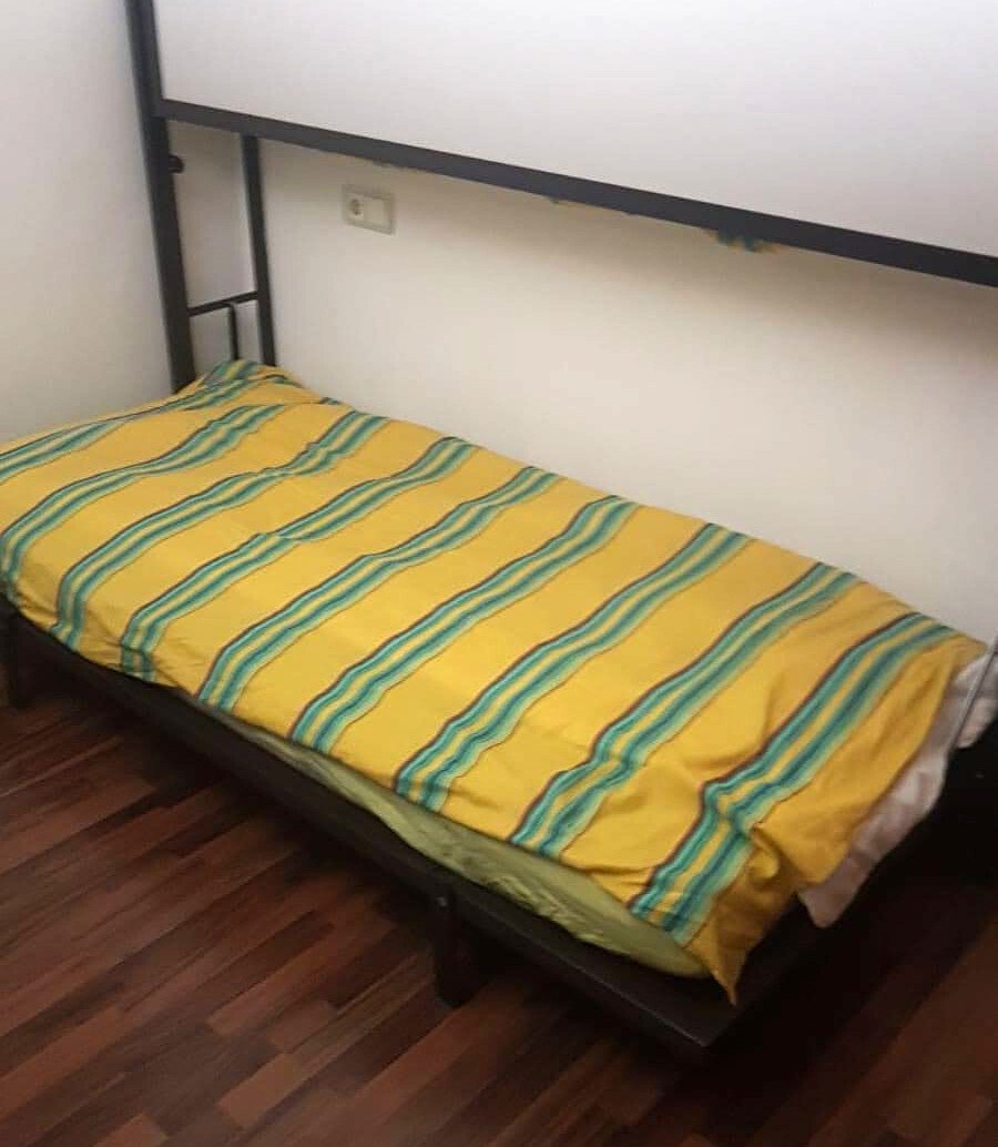 Comfortable bedroom with parquet flooring and practical storage under the bed. Comfortable bedroom with parquet flooring and practical storage under the bed.