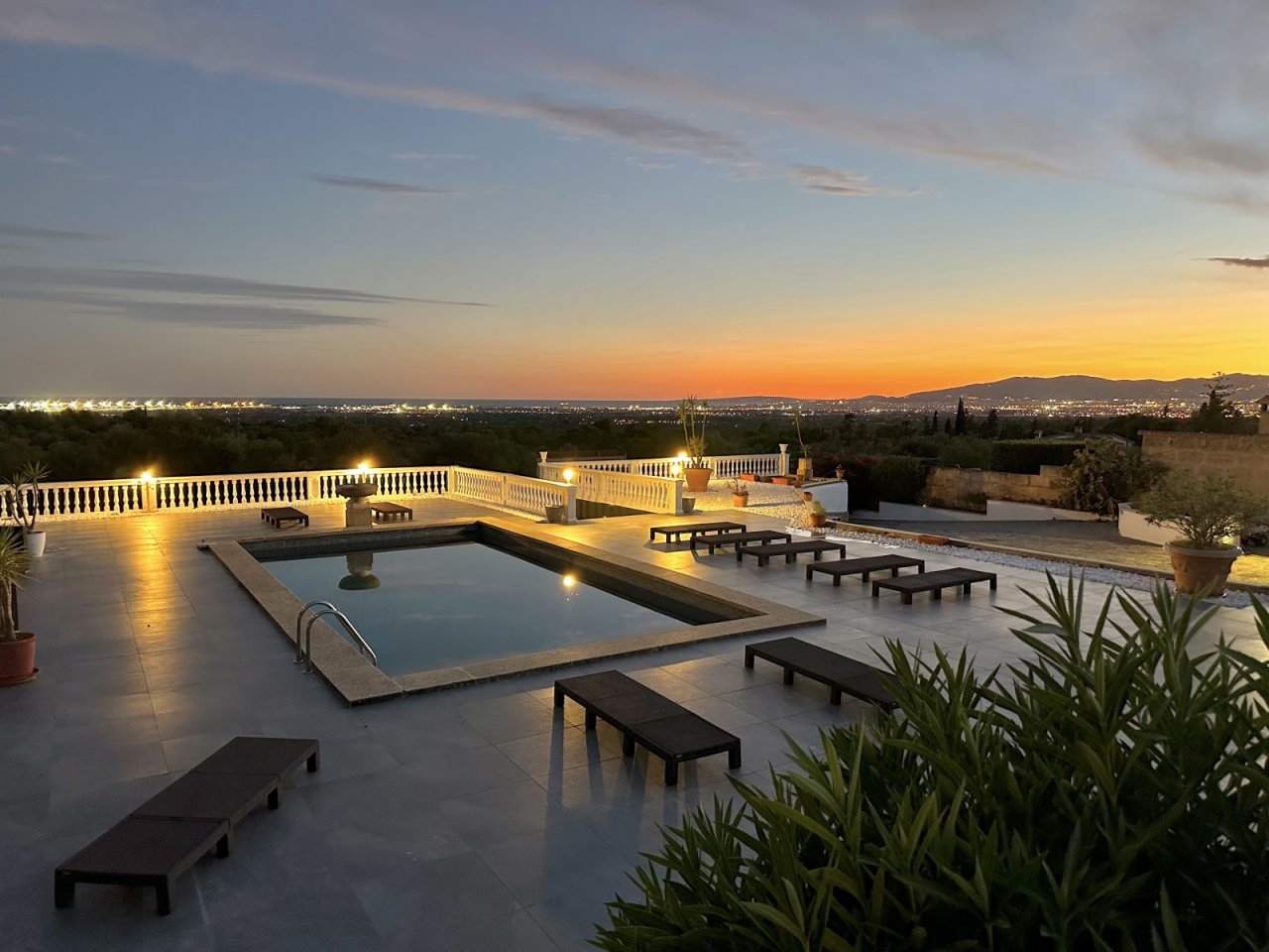 Luxurious outdoor area with heated swimming pool and panoramic view of the city