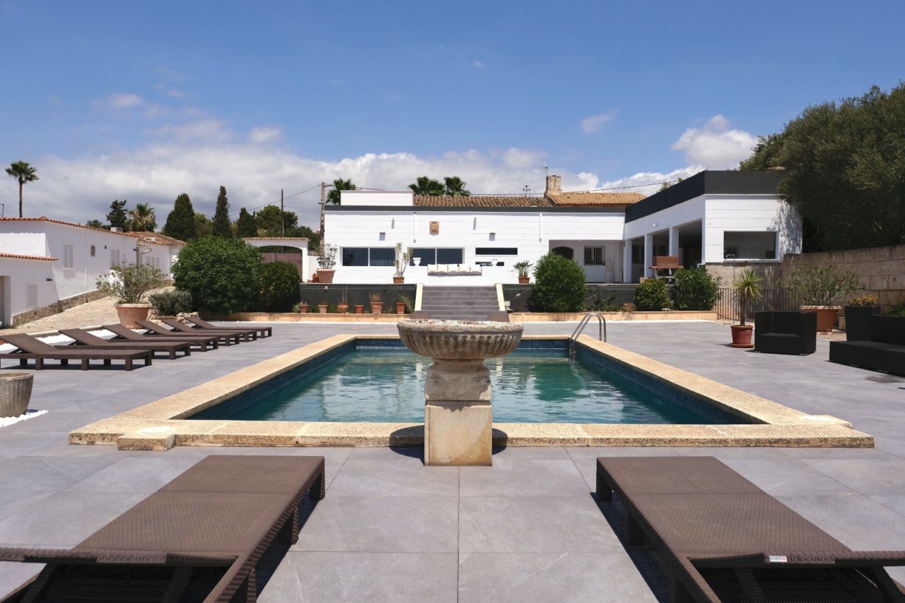 Pool area with elegant terrace design and a representative open space