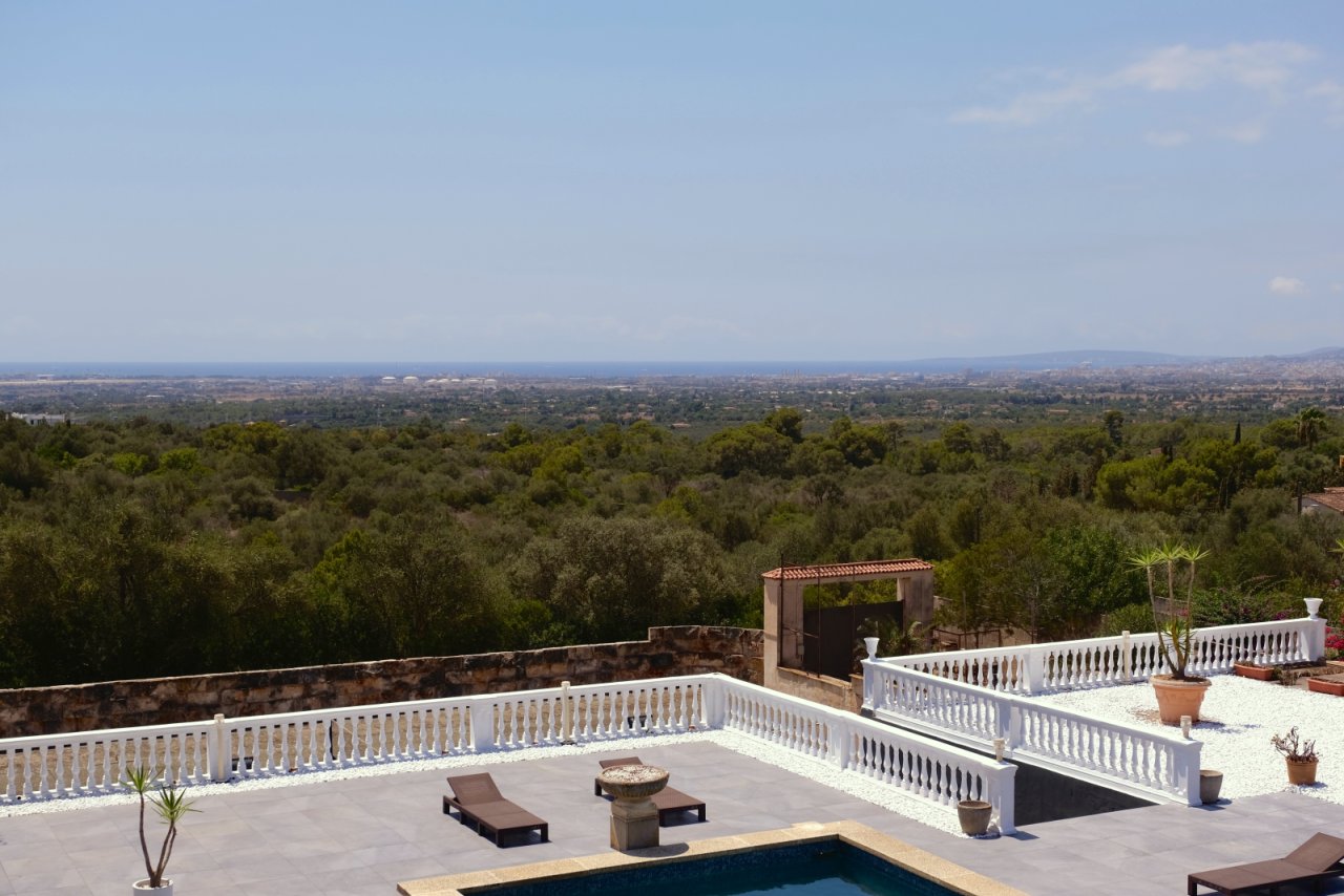 Spectacular rooftop terrace with elegant balustrade and breathtaking panoramic view of the mountain scenery