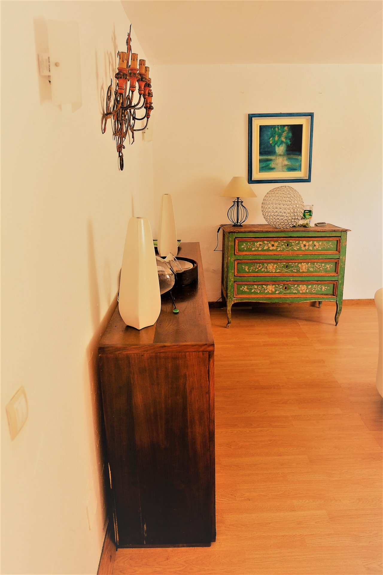 Elegant hallway with warm wooden flooring and optimal room depth