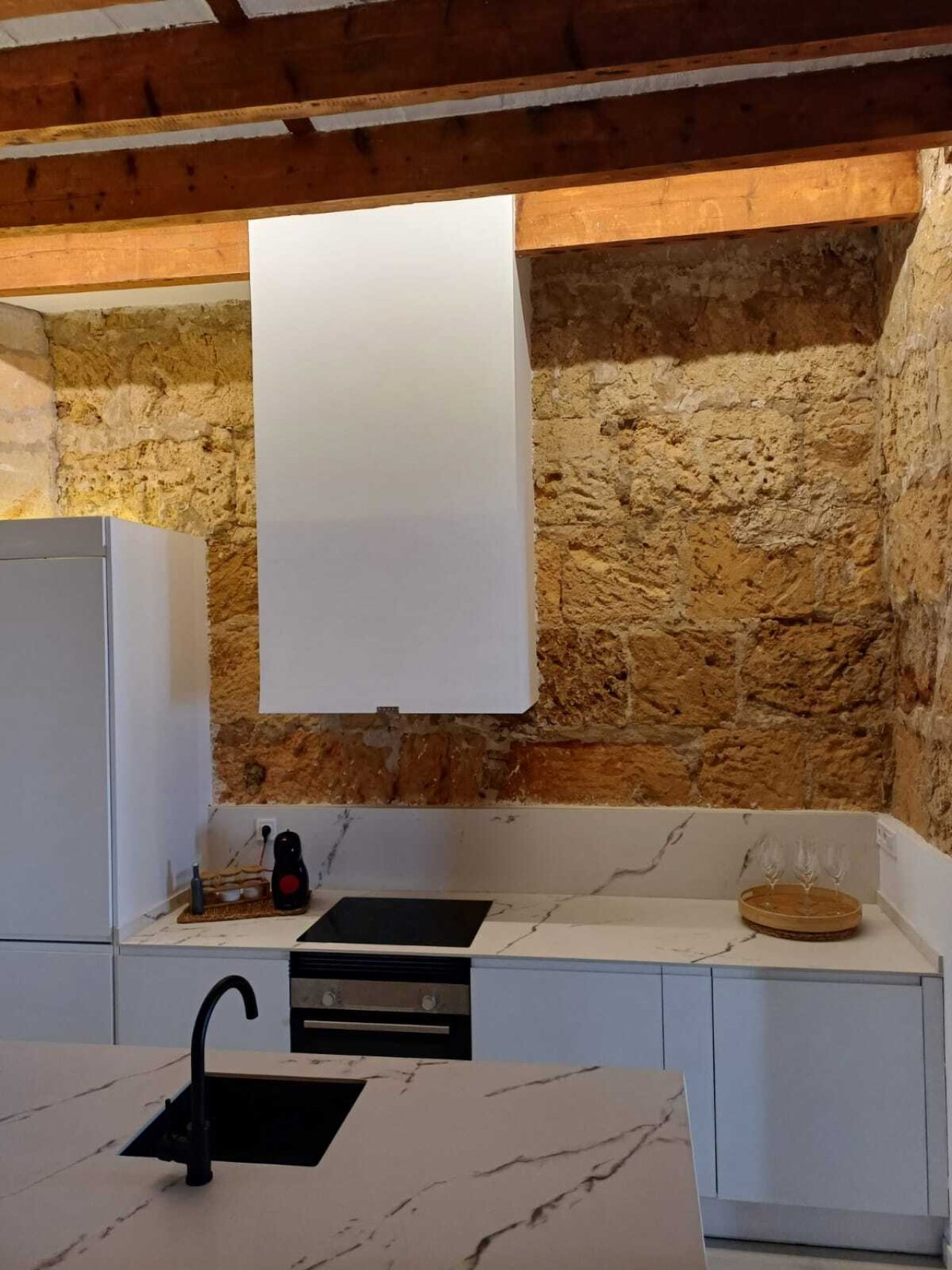 Authentic stone walls meet modern kitchen equipment – character and functionality combined Authentic stone walls meet modern kitchen equipment – character and functionality combined
