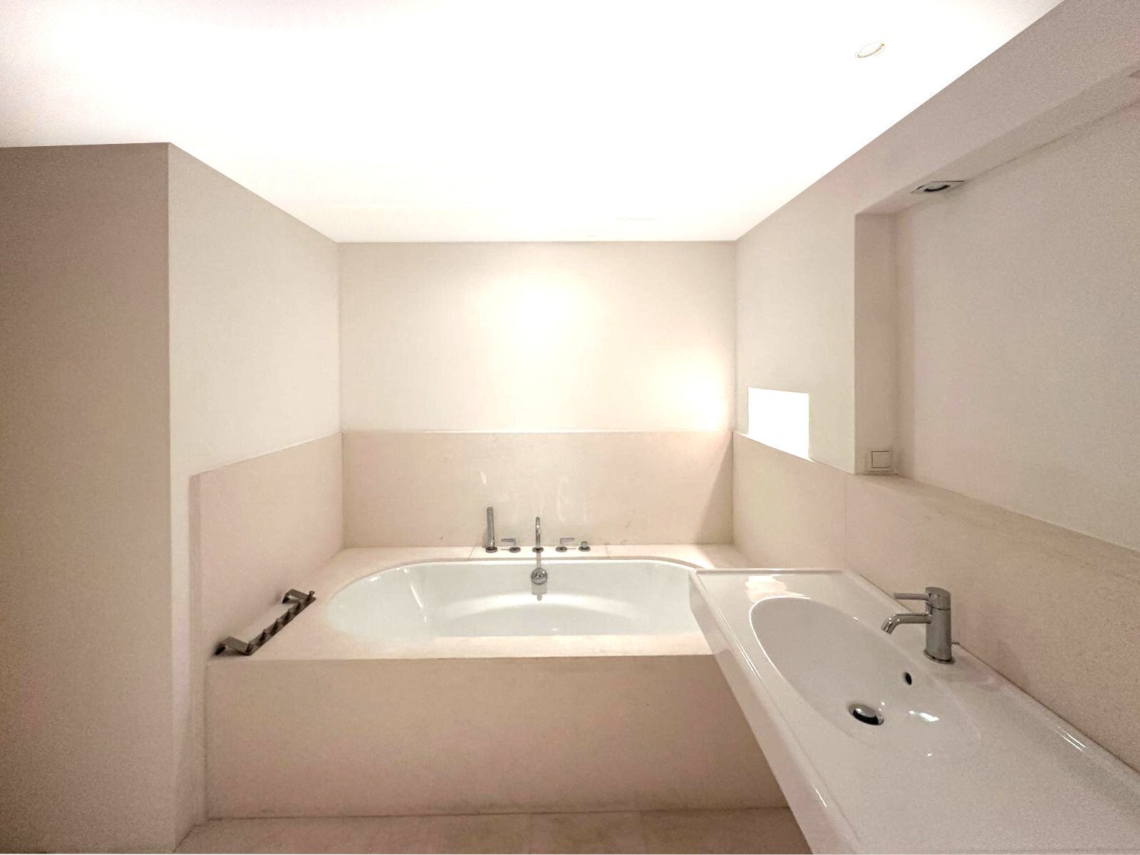 Modern bathroom with freestanding bathtub and practical double washbasin unit