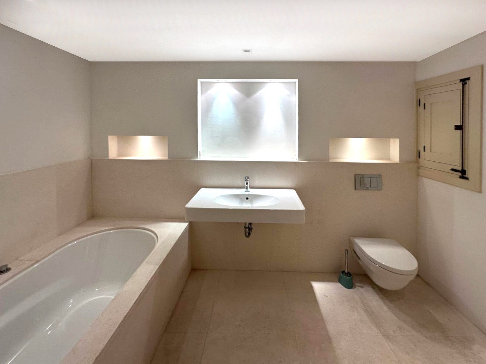 Modern bathroom with large-format window and intelligent lighting concept