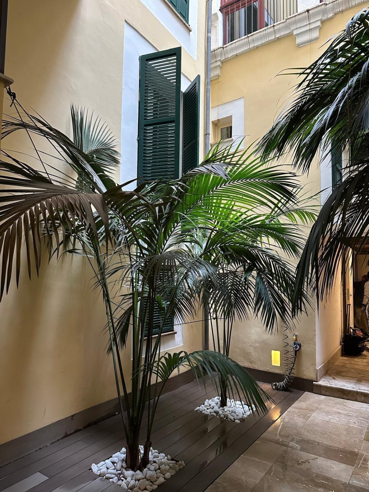 Courtyard with light well and elegant shutter elements