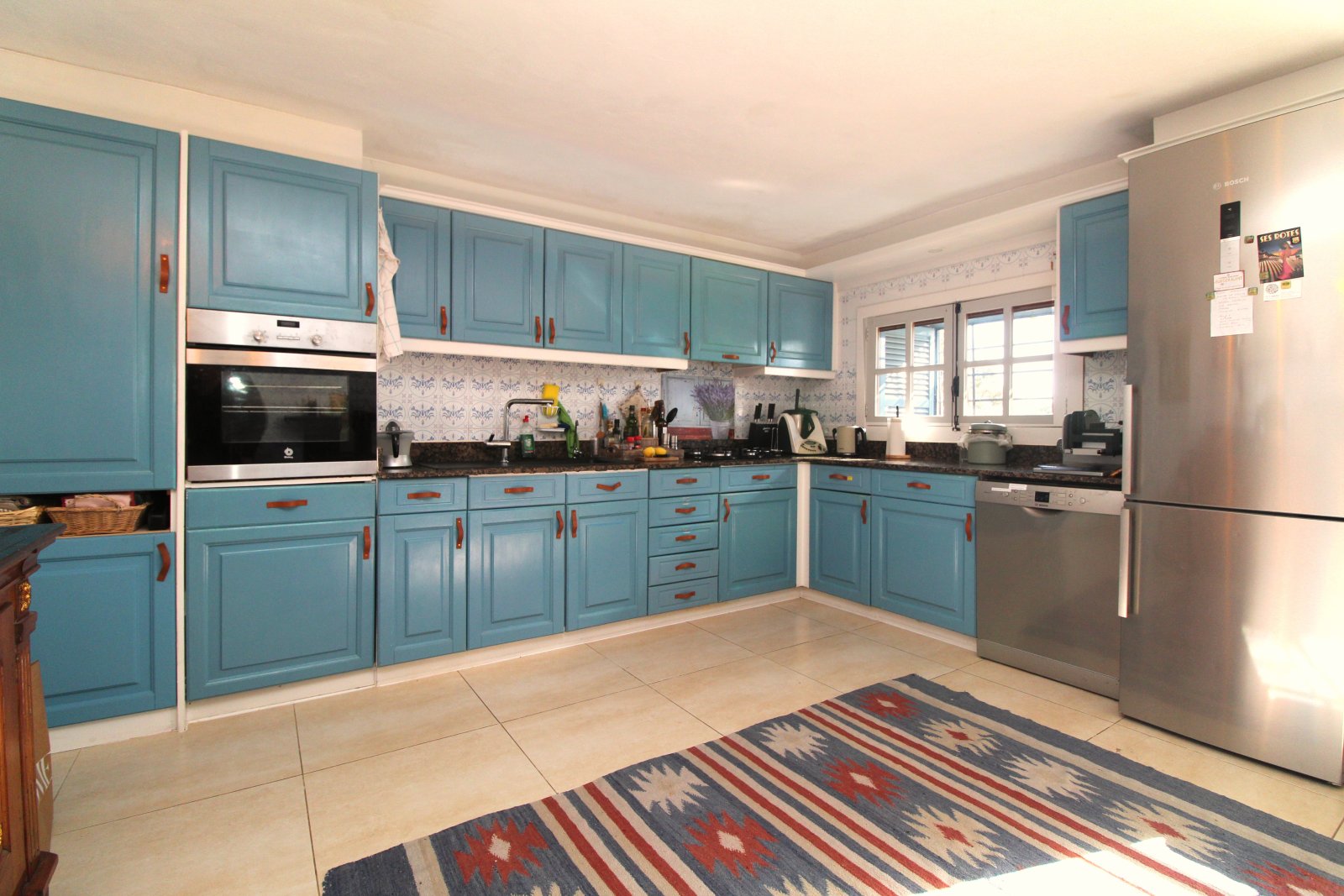 Modern kitchen with high-quality built-in appliances and optimal workspace layout