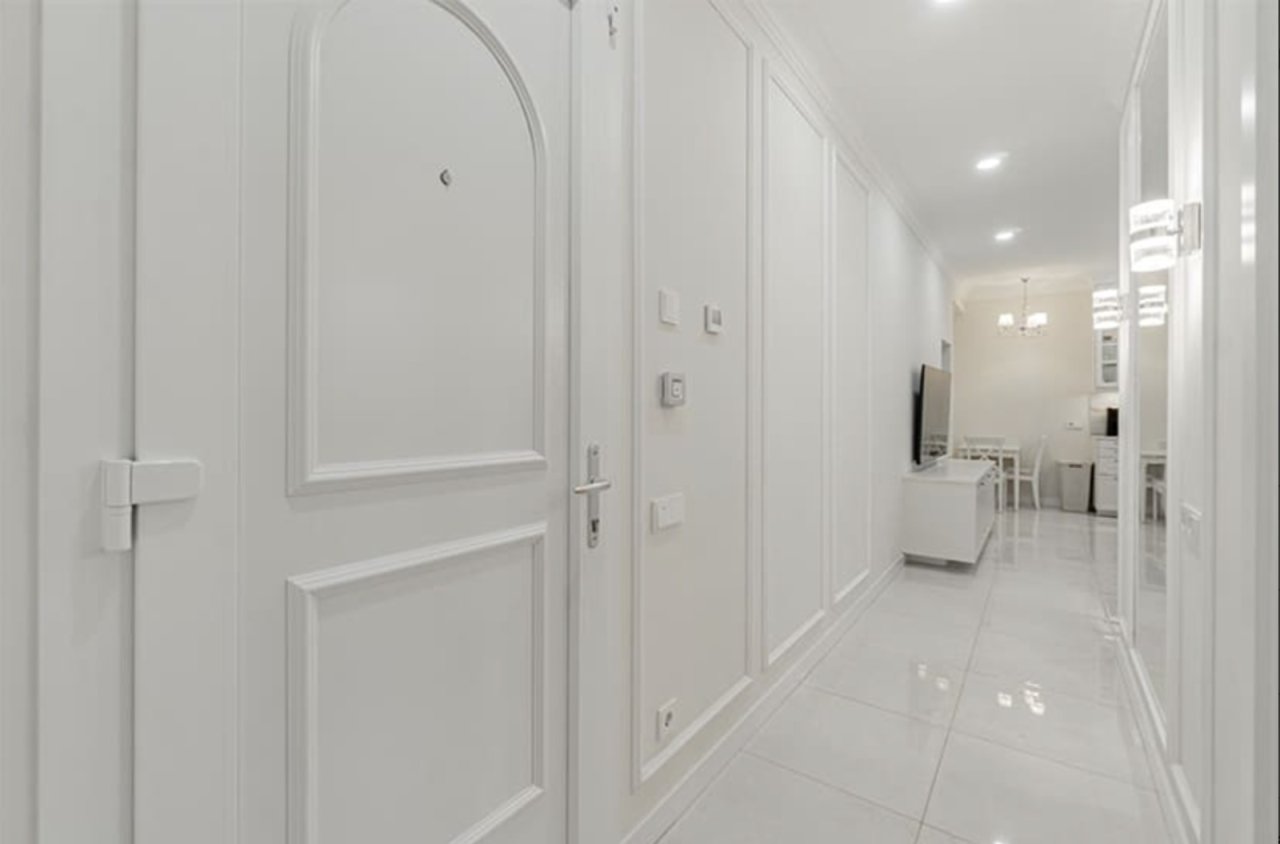 Bright corridor with practical built-in wardrobes and optimal layout