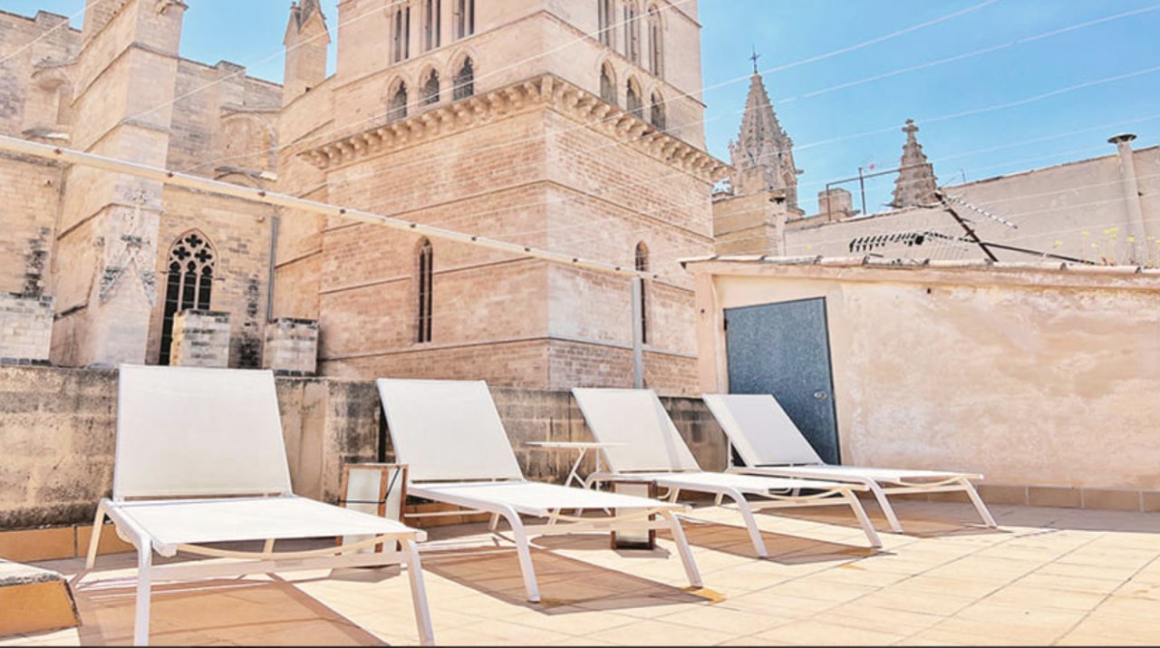 Roof terrace with an unobstructed view of historic architecture