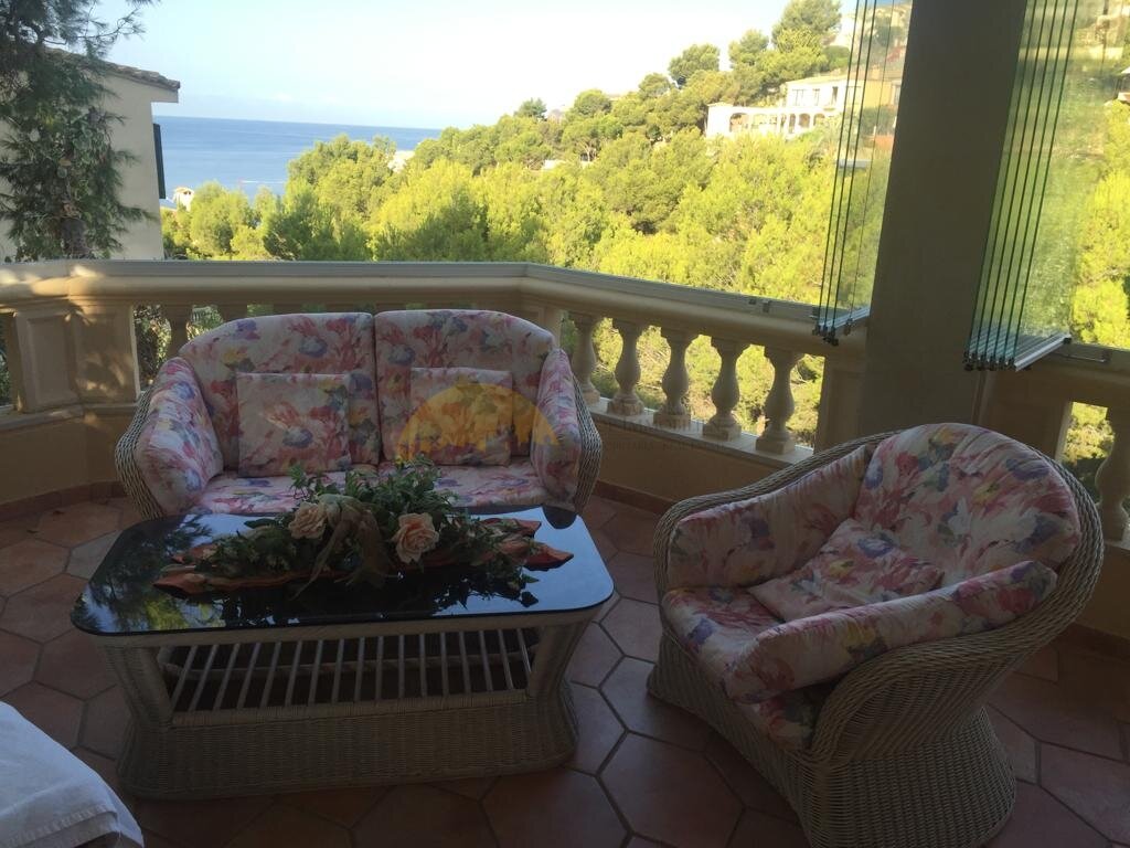 Sea view loggia with elegant balustrade and unobstructed view of the bay