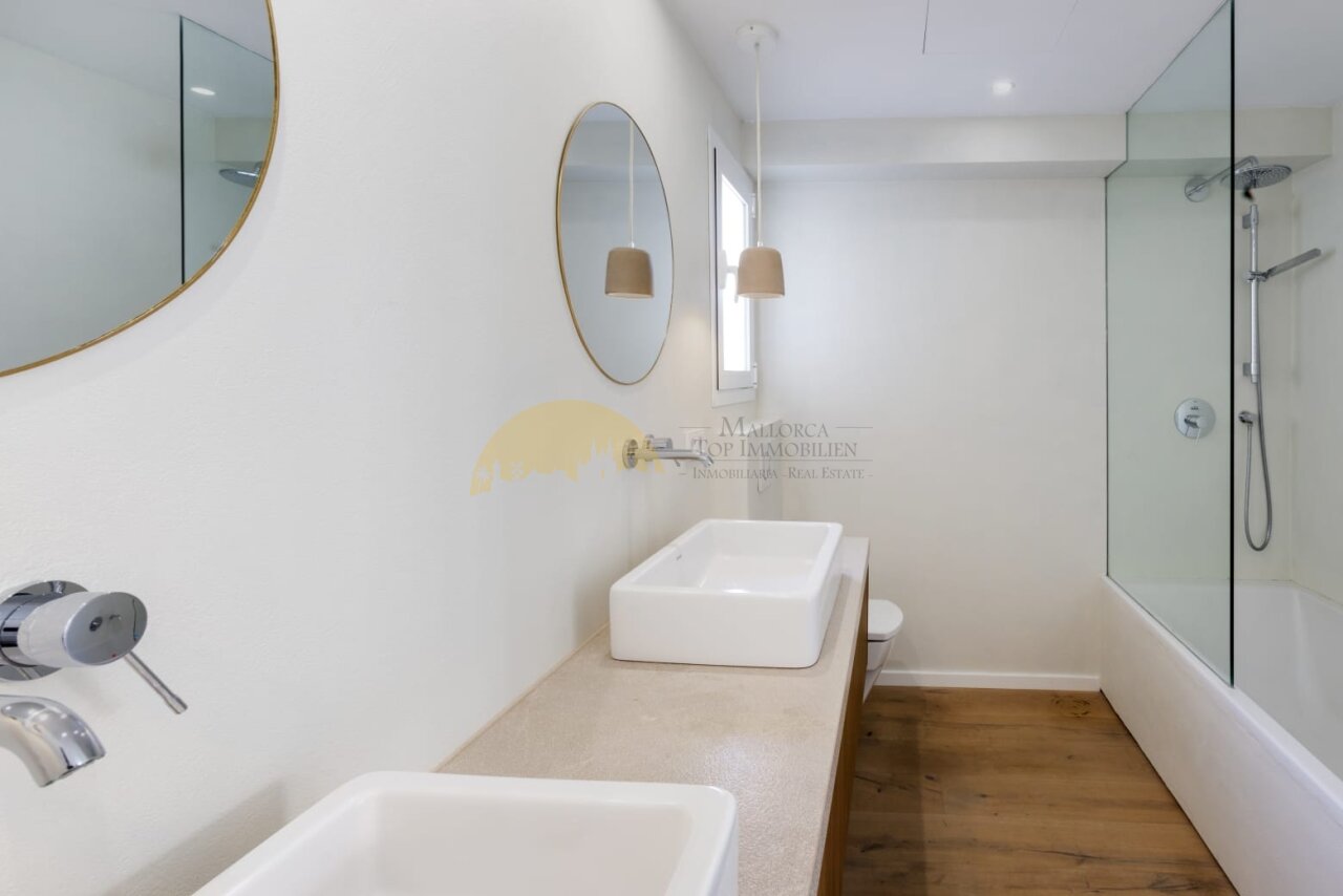 Modern bathroom with walk-in shower and double vanity area Modern bathroom with walk-in shower and double vanity area