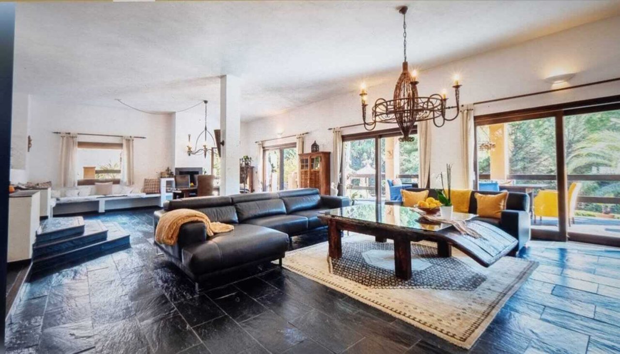 Bright living room with open layout and large windows Bright living room with open layout and large windows