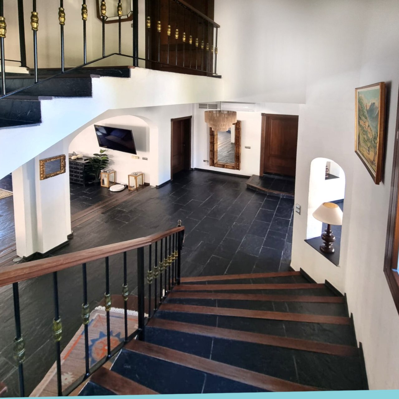 Elegant entrance hall with open floor plan and high-quality natural stone floors Elegant entrance hall with open floor plan and high-quality natural stone floors