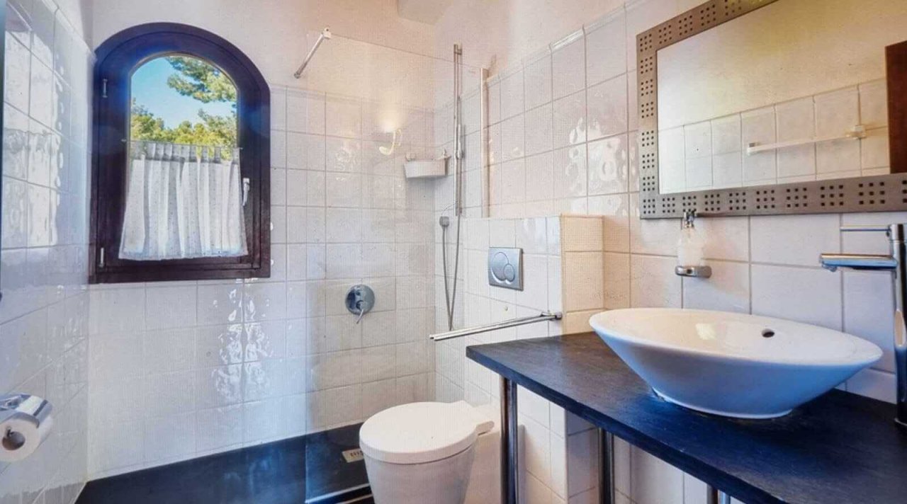 Modern bathroom with walk-in shower, double vanity, and spacious mirror front Modern bathroom with walk-in shower, double vanity, and spacious mirror front
