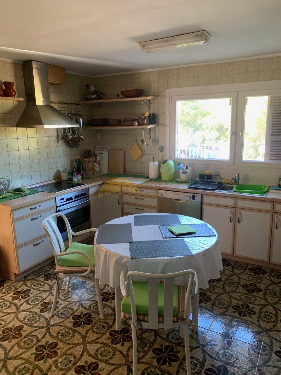 Functional kitchen with practical work surface and adjacent dining area Functional kitchen with practical work surface and adjacent dining area