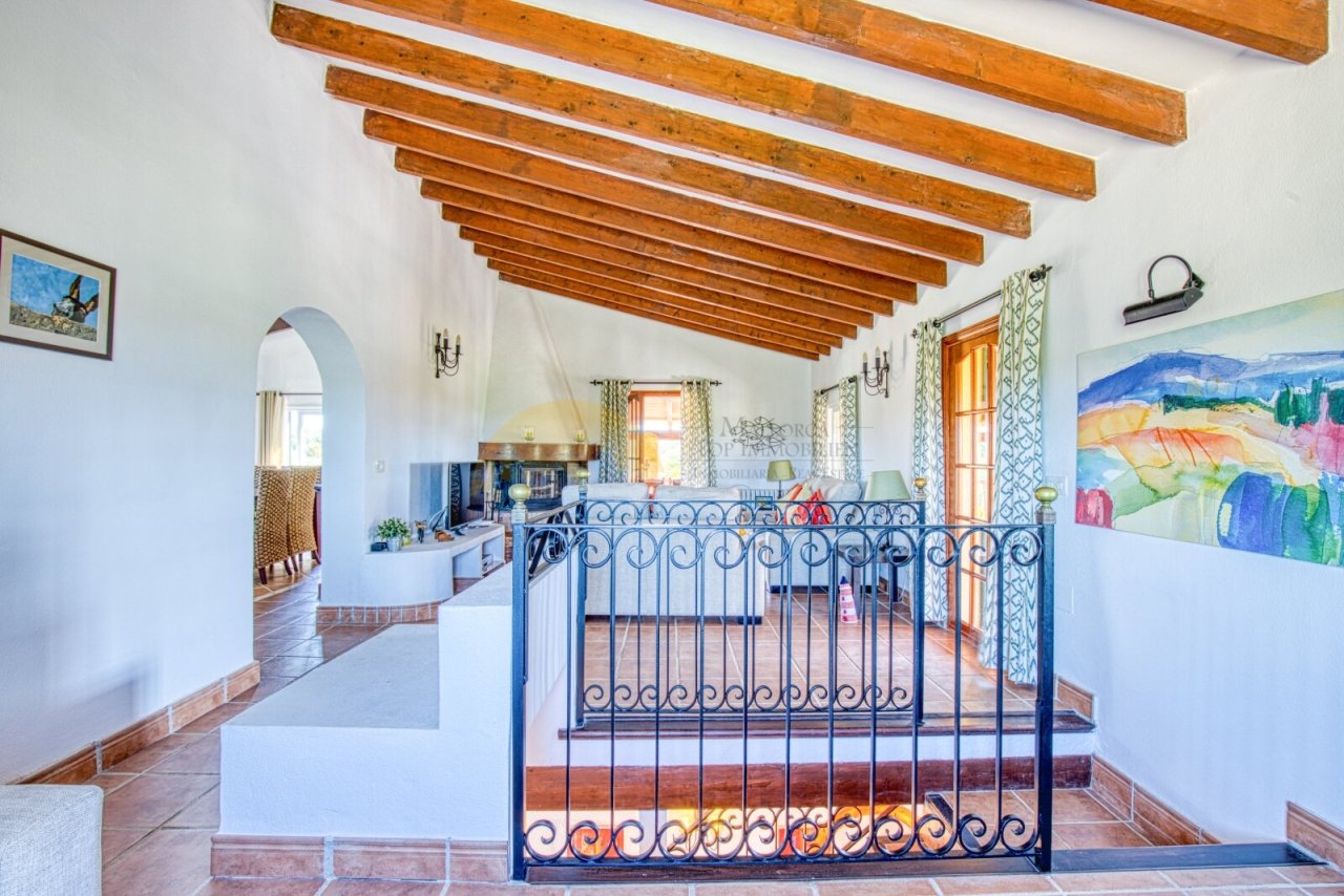 Open living area with characterful wooden beams and elegant room connection Open living area with characterful wooden beams and elegant room connection