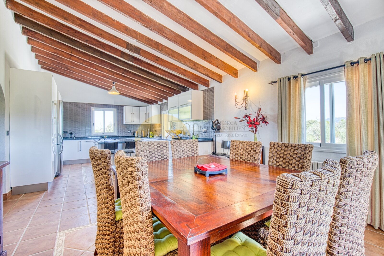 Living and dining area with distinctive wooden beams and an open connection to the kitchen Living and dining area with distinctive wooden beams and an open connection to the kitchen