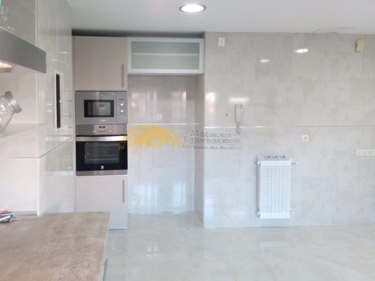 Modern kitchen with integrated serving counter and high-quality built-in appliances