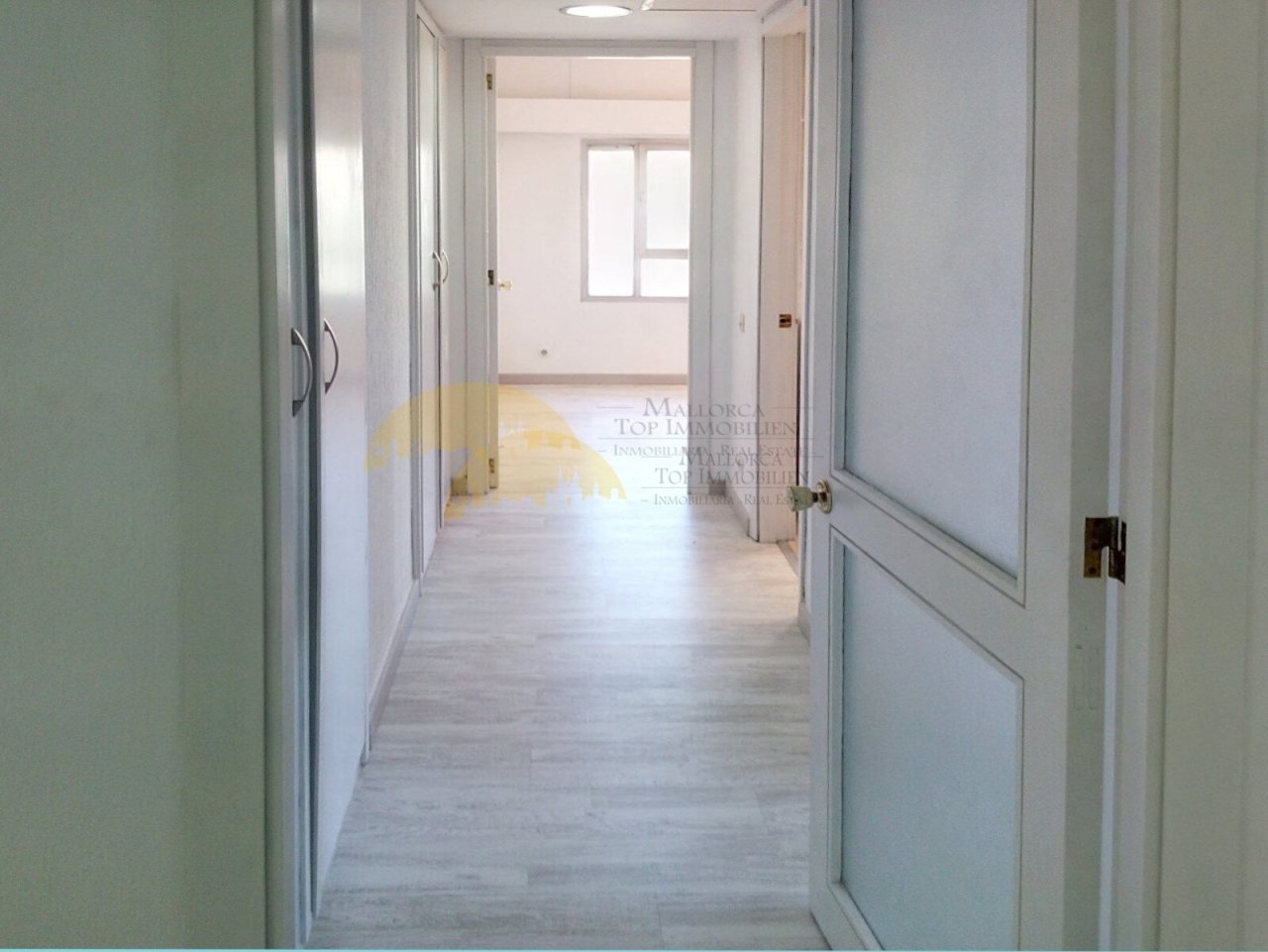 Functional corridor with optimal space utilization and bright lighting