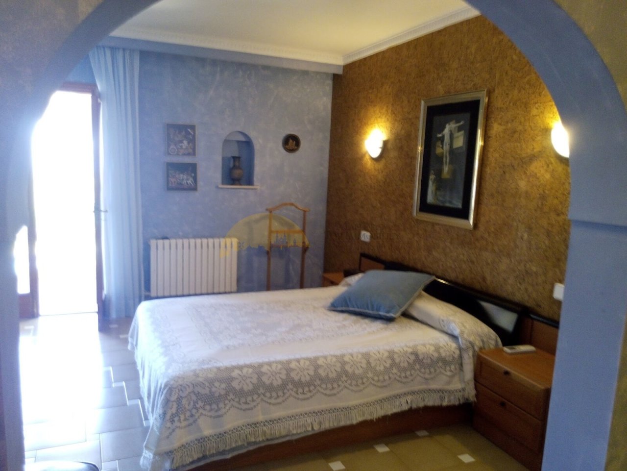 Bedroom with terrace access and elegant wall design