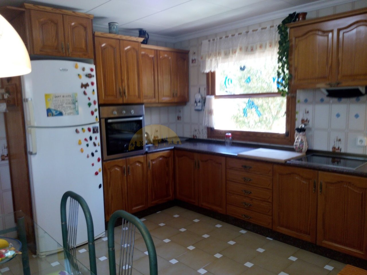 Functional kitchen with extensive cabinet storage and spacious work surface