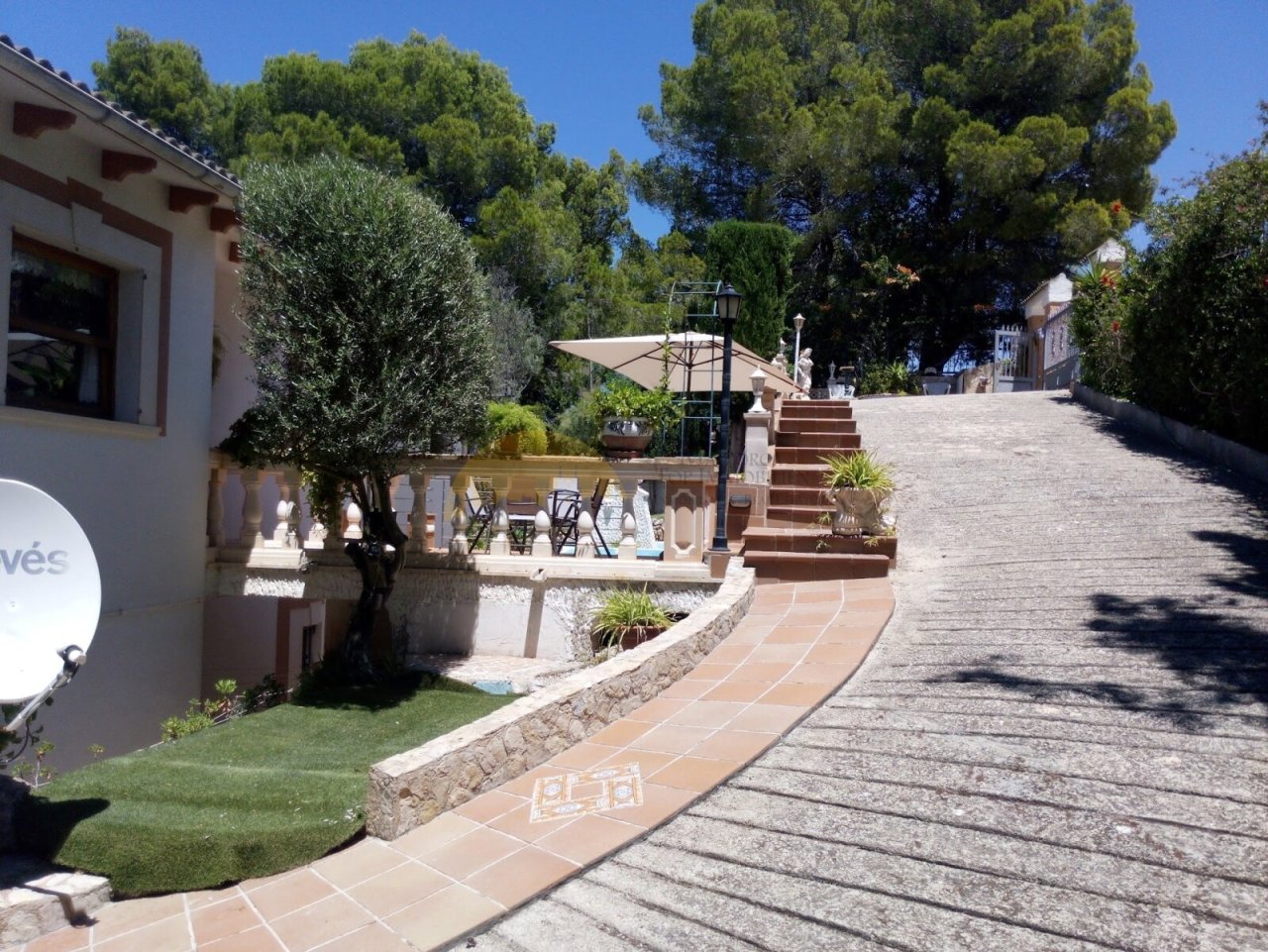 Spacious outdoor area with elegant pathway design and barrier-free pool access