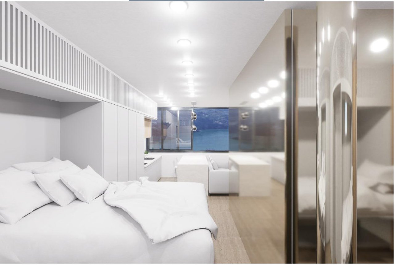 Área de dormir con vestidor integrado y pared de armario con espejos