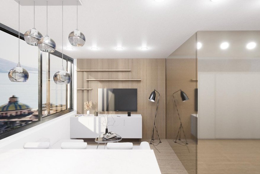 Área de estar con un concepto de medios bien pensado y una elegante pared de acento