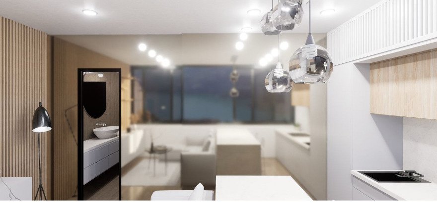 Zona de estar abierta con zona de cocina integrada y diseño elegante de lámparas colgantes