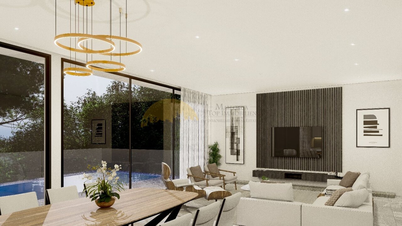 Espacio de estar con mucha luz natural, con ventanales correderos de piso a techo y zona de chimenea integrada Espacio de estar con mucha luz natural, con ventanales correderos de piso a techo y zona de chimenea integrada