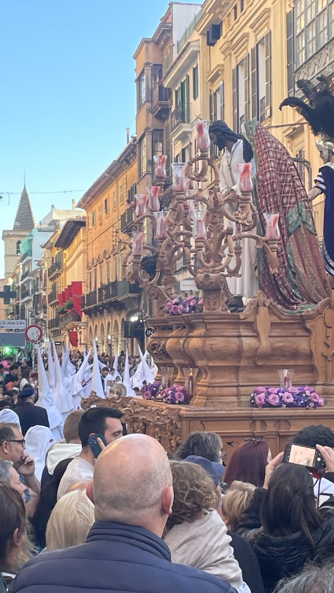 Holy Week night procession with oil lamps lighting Calvari steps