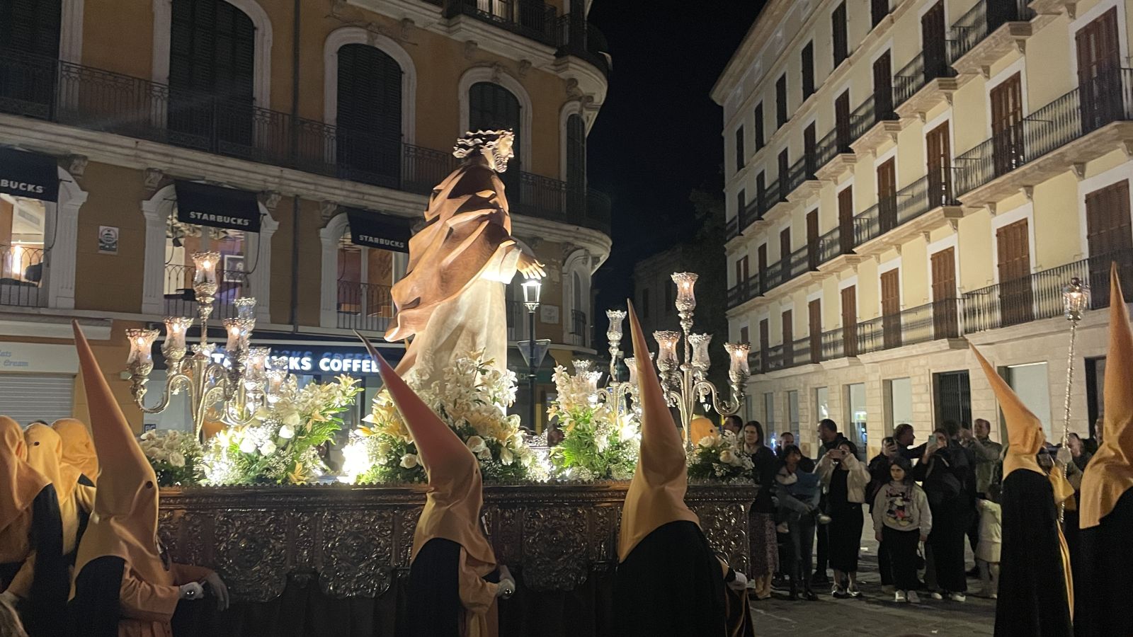 Holy Week preparation in Manacor with robe fittings and candles